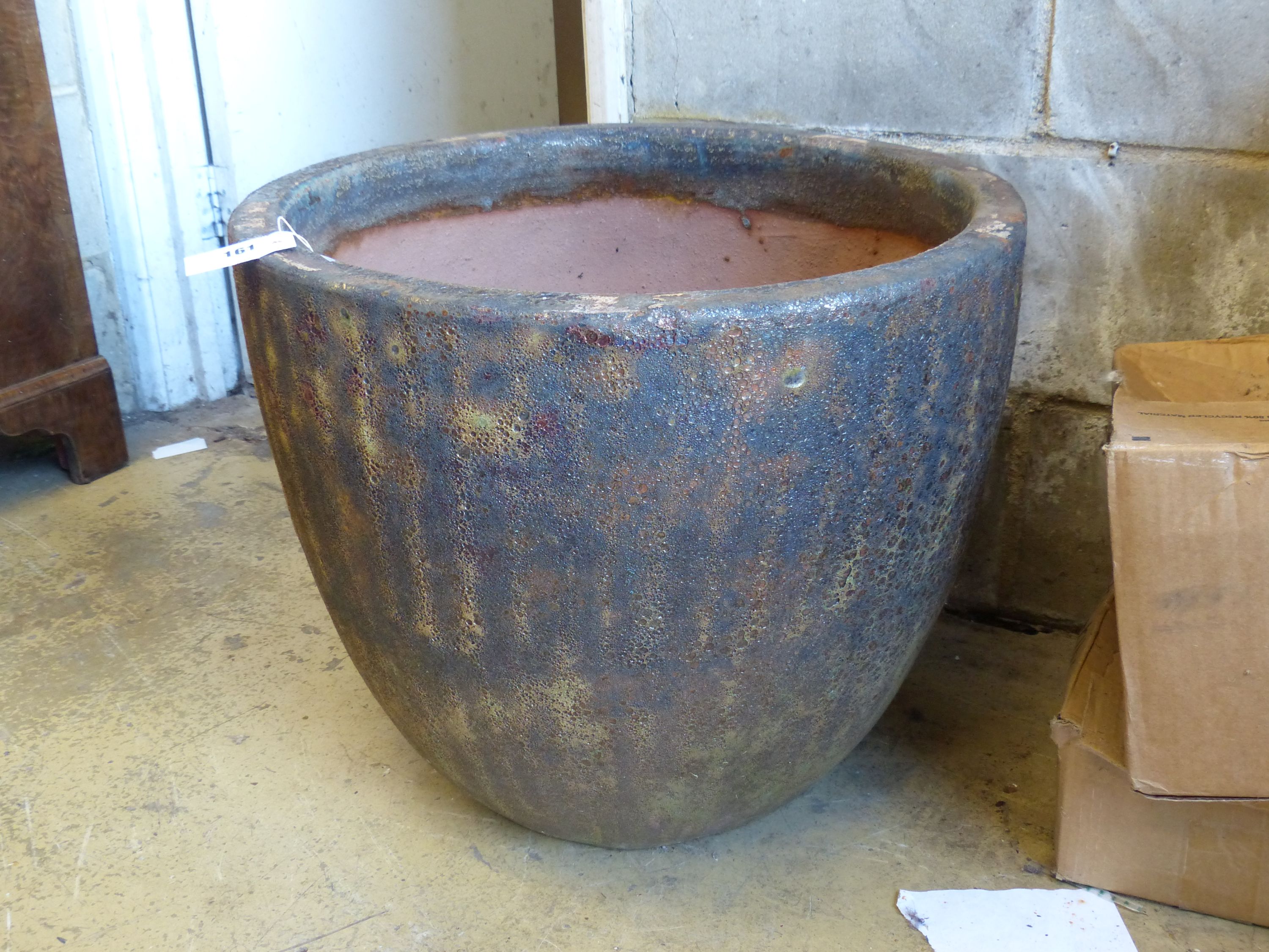 A large glazed earthenware garden planter, diameter 57cm, height 46cm